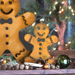 Gingerbread Man Sculpture – Add a gingerbread man to your holiday decor lineup for a playful touch small displayed with holiday decorations