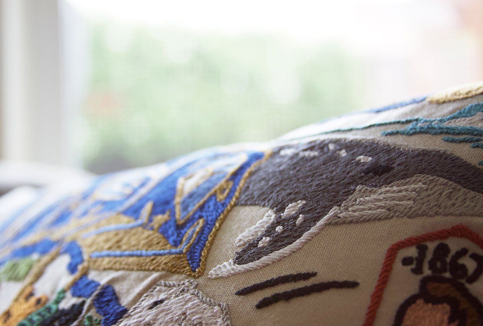 Alaska Hand-Embroidered Pillow -  This original design celebrates The Last Frontier—the state of Alaska