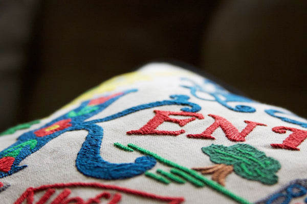 Kentucky Hand-Embroidered Pillow -  The Bluegrass State! This original design celebrates the State of Kentucky - from Cumberland Falls to Bowling Green to Frankfort (not Germany - ha! ha!) while riding on the bluegrass!