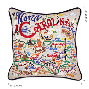 North Carolina Hand-Embroidered Pillow -  What a beautiful state! This original design celebrates the state of North Carolina—from Cape Fear to Asheville to Duck to Kitty Hawk, where man's first flight took place.