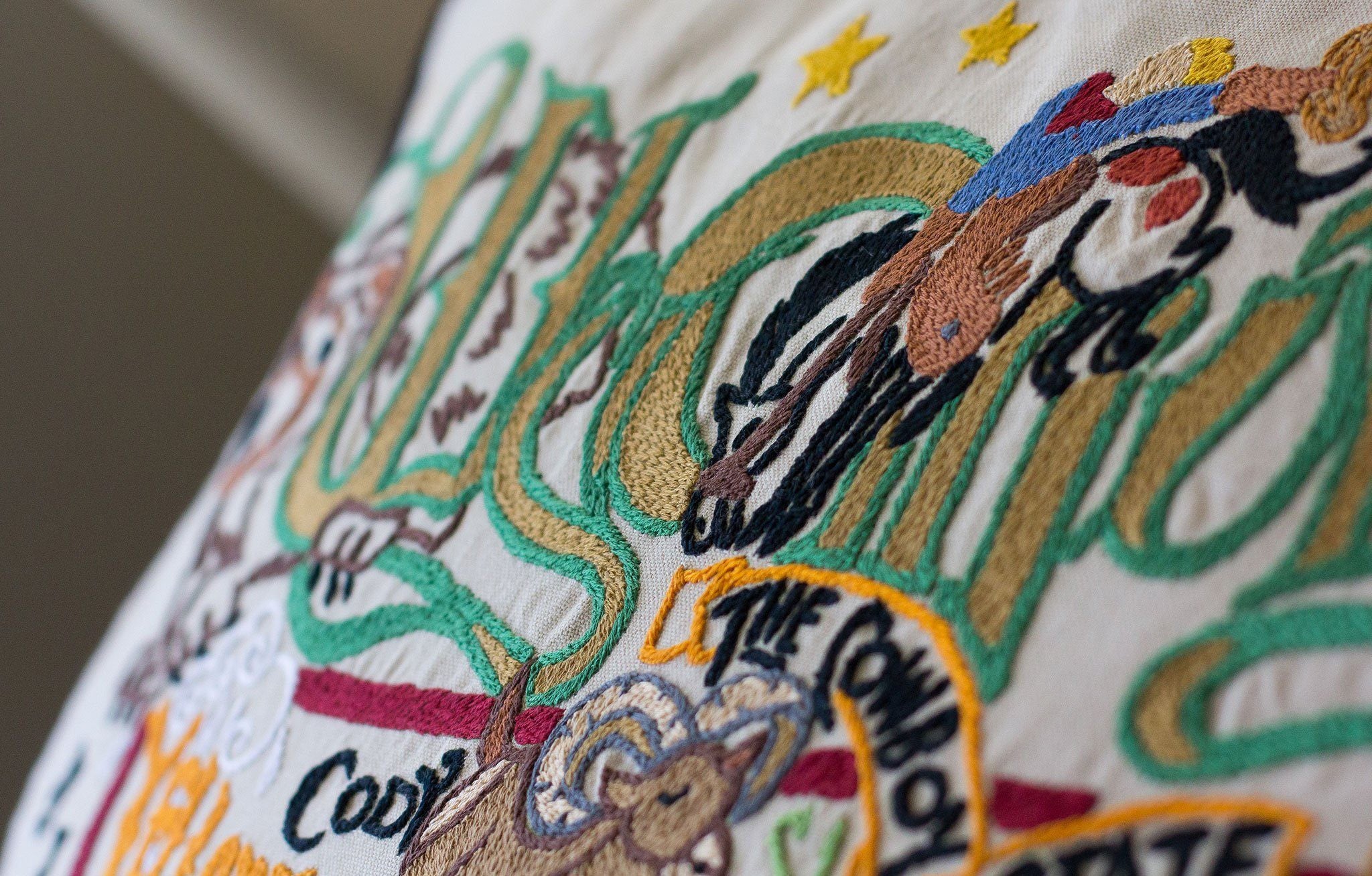 Wyoming Hand-Embroidered Pillow -  The Cowboy State! This original design celebrates the State of Wyoming. Terrell, one of catstudio's owners, has a great uncle who was the sheriff of Jackson Hole in the 50's!